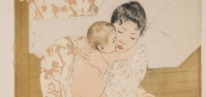 A print shows a dark-haired, light-skinned woman sitting in a chair before a simple bed and closely embracing a naked infant. The baby’s arm encircles her neck, and their cheeks touch. The lack of shading and the pattern repeated on the back wall and chair flatten the space.