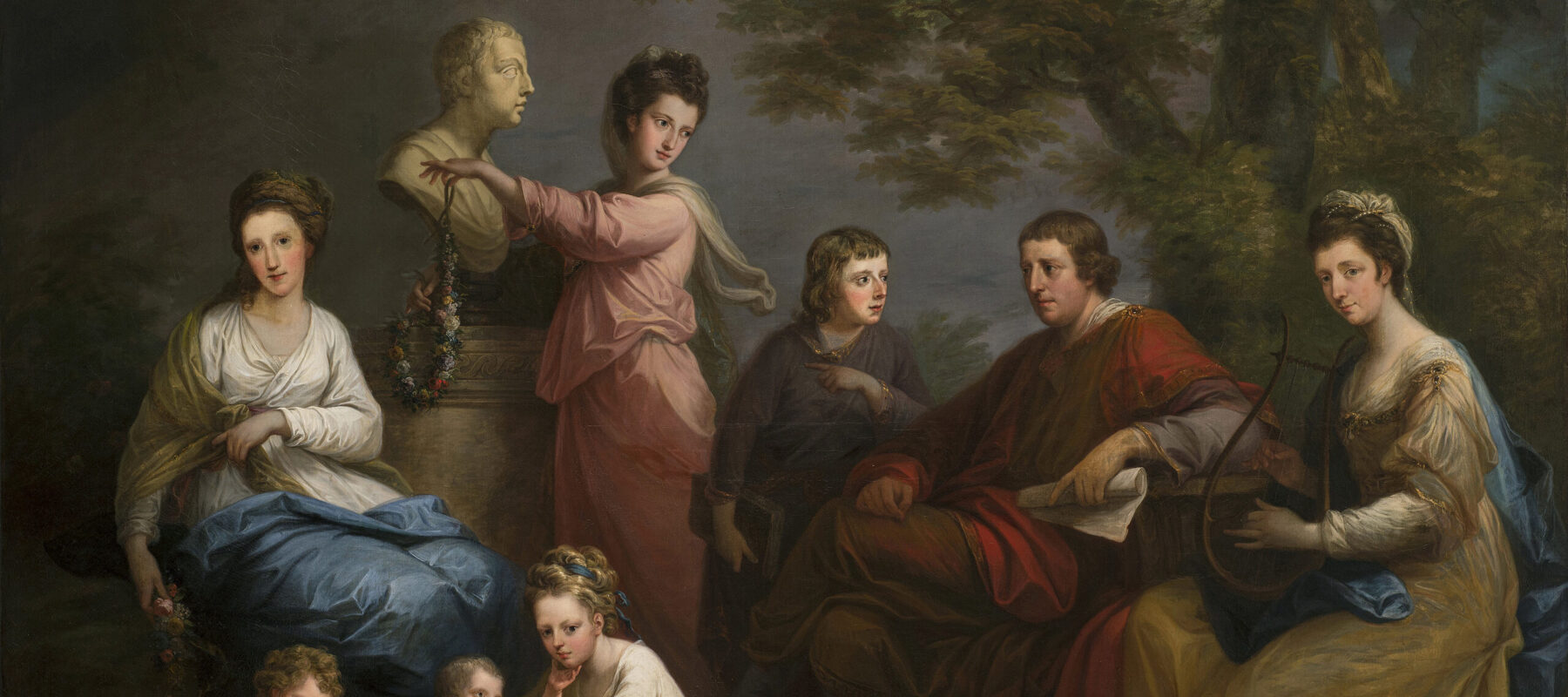 A realistic painting features eight light-skinned figures arranged in a pastoral setting: three women, two men, and a young girl tending to two toddlers. The scene includes classical references such as lyrical costumes, lyre, scroll, floral garlands, and marble bust.