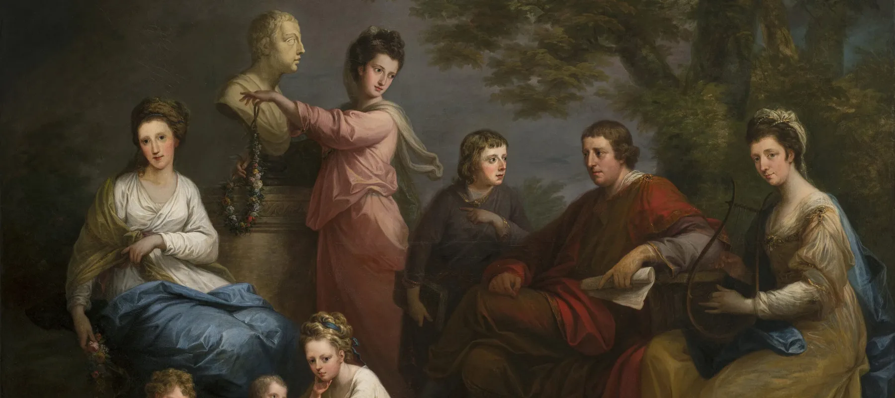 A realistic painting features eight light-skinned figures arranged in a pastoral setting: three women, two men, and a young girl tending to two toddlers. The scene includes classical references such as lyrical costumes, lyre, scroll, floral garlands, and marble bust.