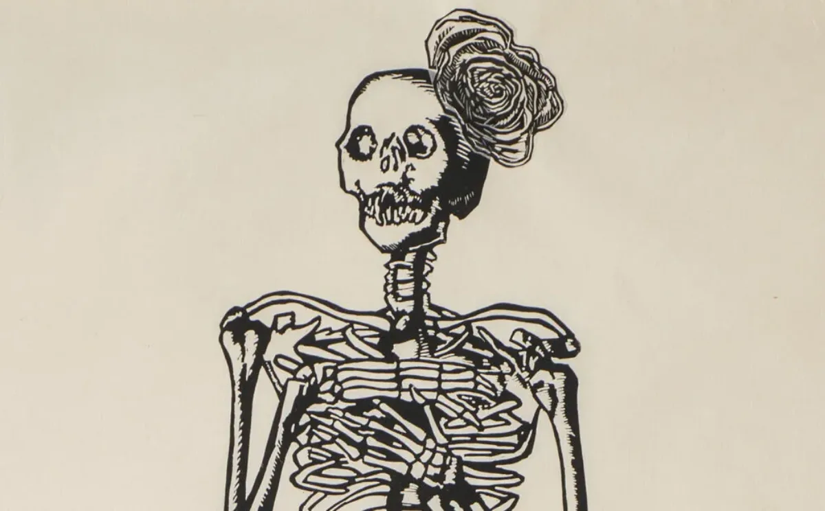 A very tall and narrow, black-and-white print depicts a skeleton with folded arms and a rose fascinator perched on its head. The figure wears a collaged, three-dimensional, billowing skirt made of tissue and printed with roses.