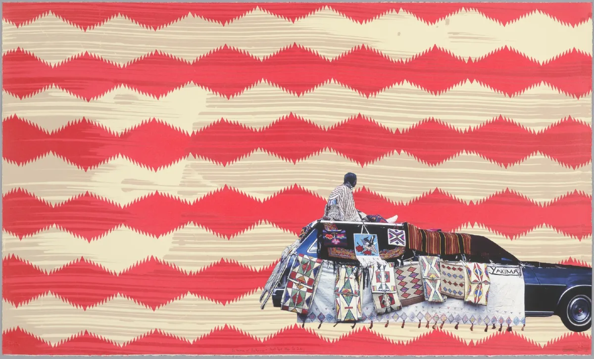 Atop a repeating geometric background of thick red and beige horizontal diamond shapes, a collaged image of a station wagon covered in geometric-patterned Indigenous blankets and tapestries is positioned to the bottom far right. A figure sits on the car's roof, at the very back.