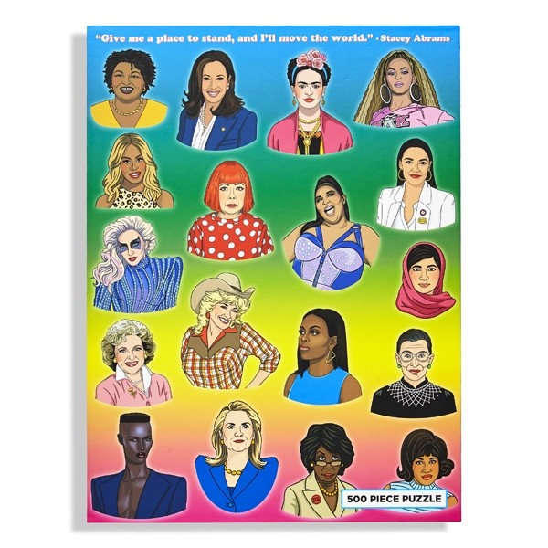 The cover of a 500-piece puzzle box shows various small, colorful, illustrated portraits of prominent women, including Beyonce, Yayoi Kusama, Lady Gaga, Michelle Obama, and more.
