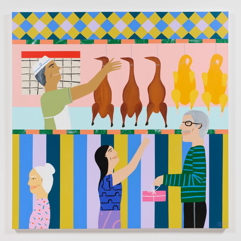 A colorful, illustrated painting shows a scene at a butcher shop, featuring a pink back wall with a row of bright, geometric tiles. A smiling man wearing a hat and apron reaches towards the bodies of three brown ducks hanging for sale, next to two turkeys. Below him, at a high counter painted in alternating stripes of yellow, blue, and white, are three customers: a smiling woman, an older smiling man, and a smiling elderly woman. The man holds a pink box wrapped in white string. The woman points up at one of the birds. The elderly woman faces away from them, seemingly walking out of frame.