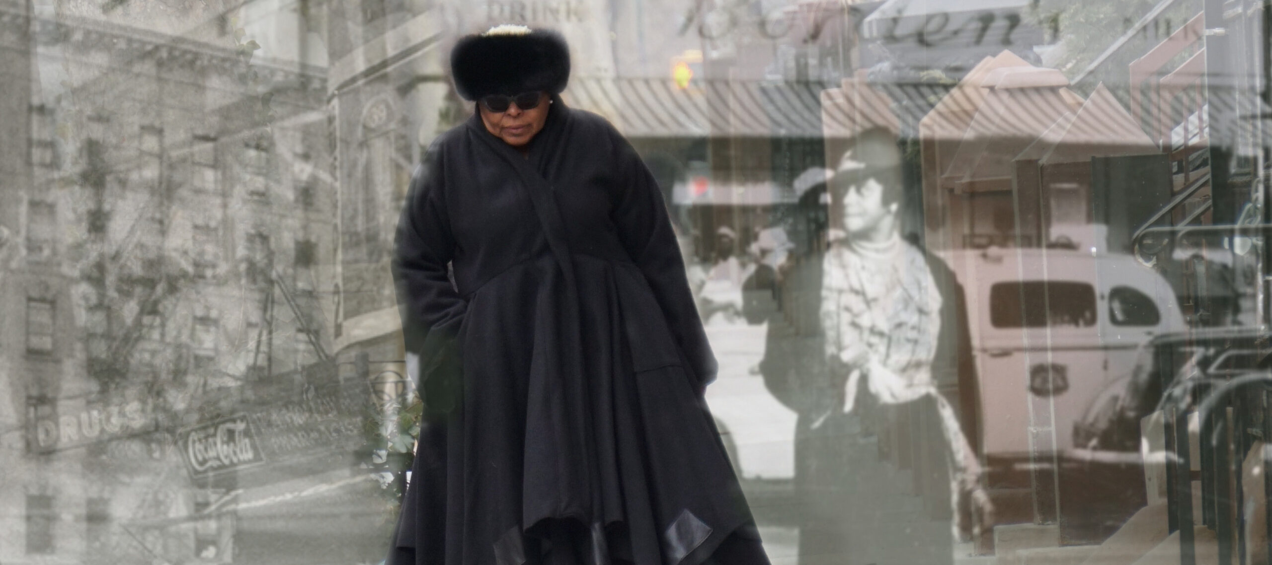 A medium-dark skinned adult woman wearing all black—a fur hat, sunglasses, boots, and a long, voluminous coat—walks on a sidewalk toward the viewer. Black and white images of people and buildings in Harlem from the early 20th century are layered over the woman.