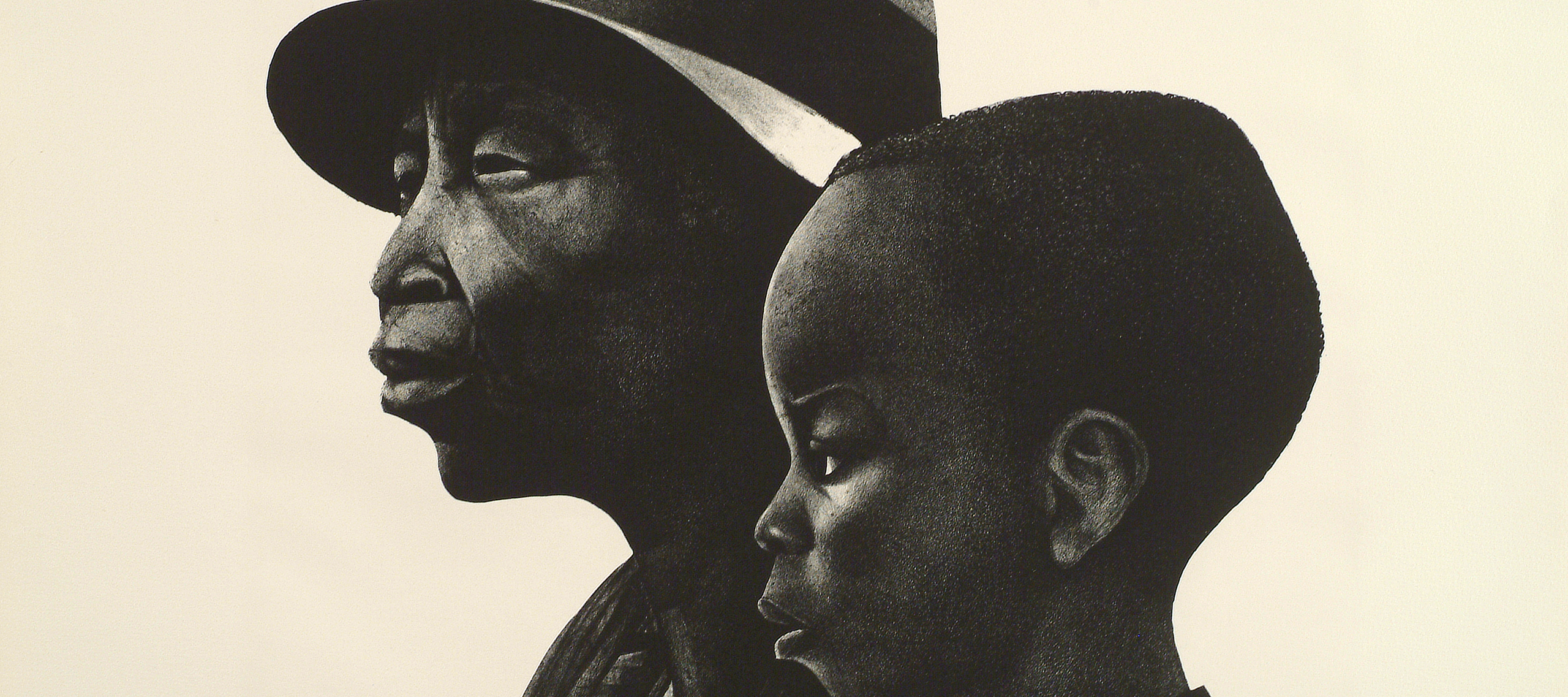 A black-and-white print of two dark-skinned individuals in profile, facing left. The person in the background is an older adult wearing a brimmed hat, and in the foreground and slightly to the right is a young child with coarse hair cut close to the head.