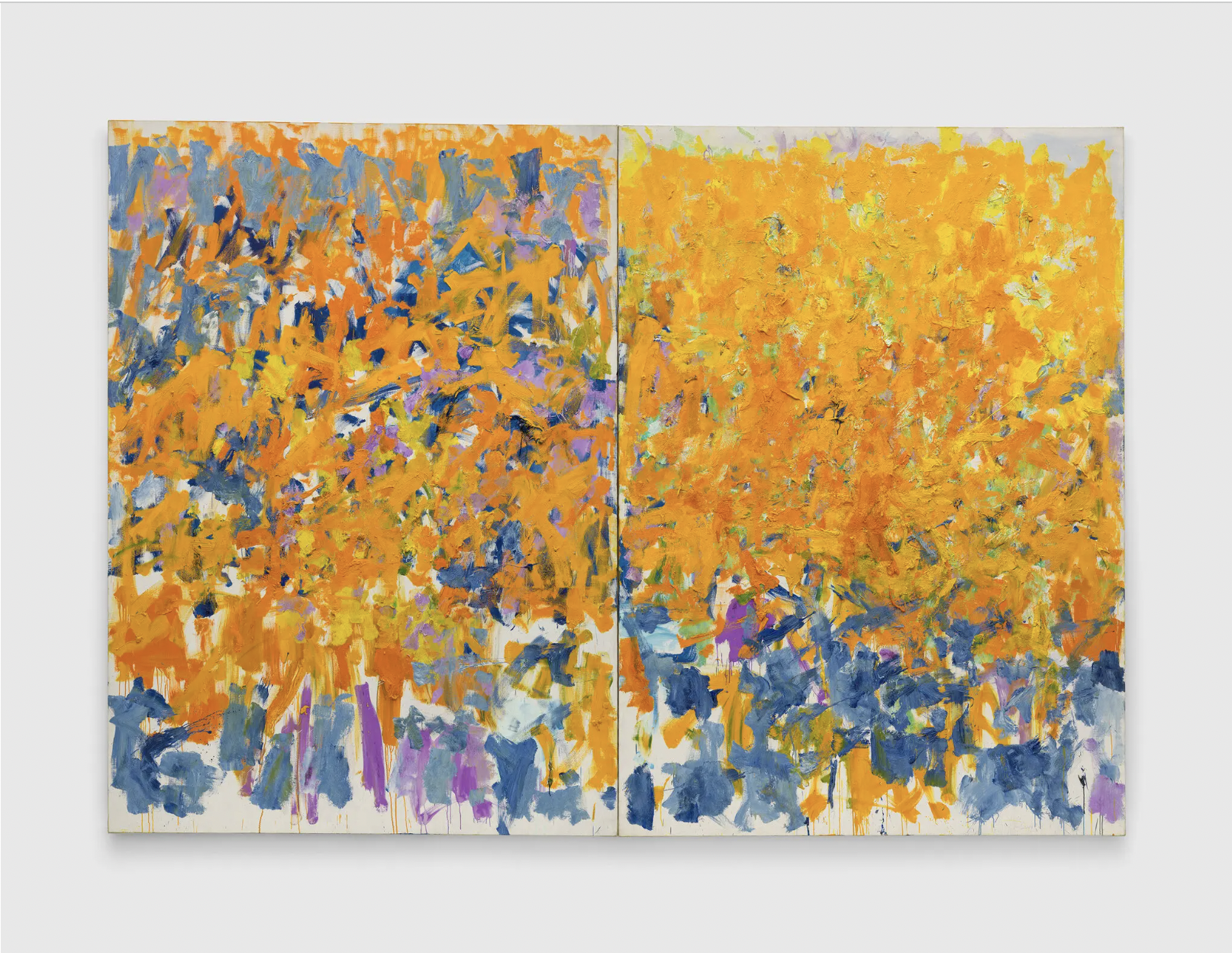 A large abstract painting consisting of two canvases features colorful brushstrokes painted in a way that resembles a close-up of an Impressionist painting. The upper half of the painting is dominated by the color yellow, while the lower half has more blue tones. At second glance, the yellow color comprises not only yellow, but orange, lilac, and blue.