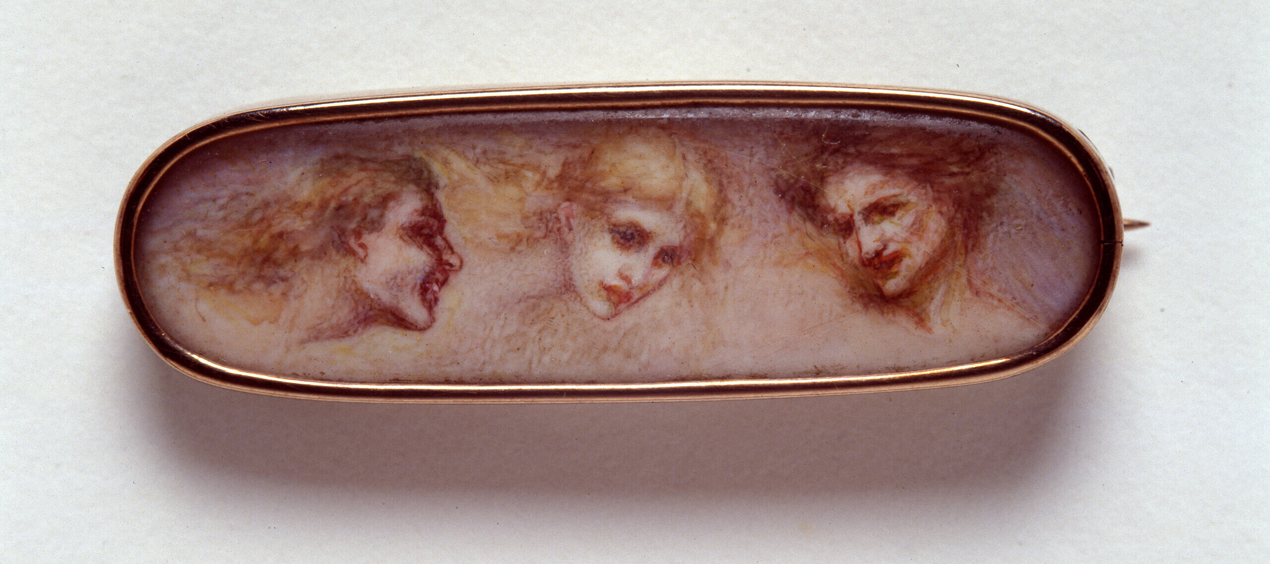 Eulabee Dix, <em>Three Heads</em> (after Edward Burne-Jones), ca. 1906; Watercolor on ivory on gold pin, 5/8 x 1 7/8 x 1/2 in.; National Museum of Women in the Arts, Gift of Mrs. Philip Dix Becker and family