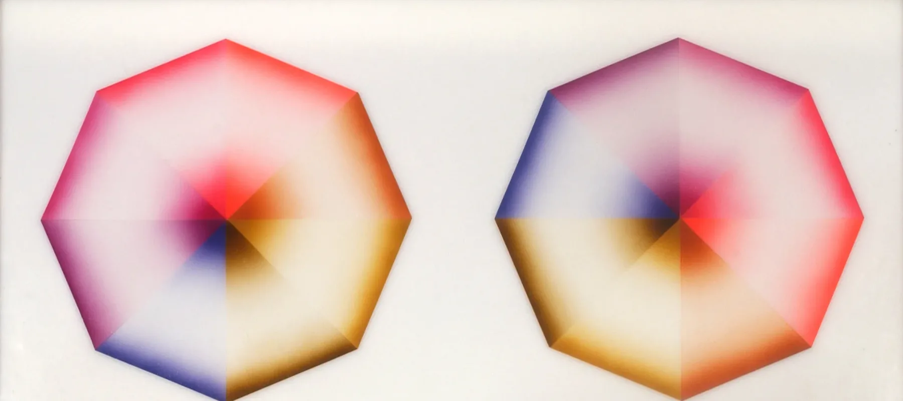 Two hard-edged octagons, each divided into eight pie-slice shapes painted red, pink, orange, yellow, olive green, blue, violet, or lavender, occupy a square, white background. Dark at the wide and narrow ends of each wedge, the hues create the illusion of 3-dimensional forms.