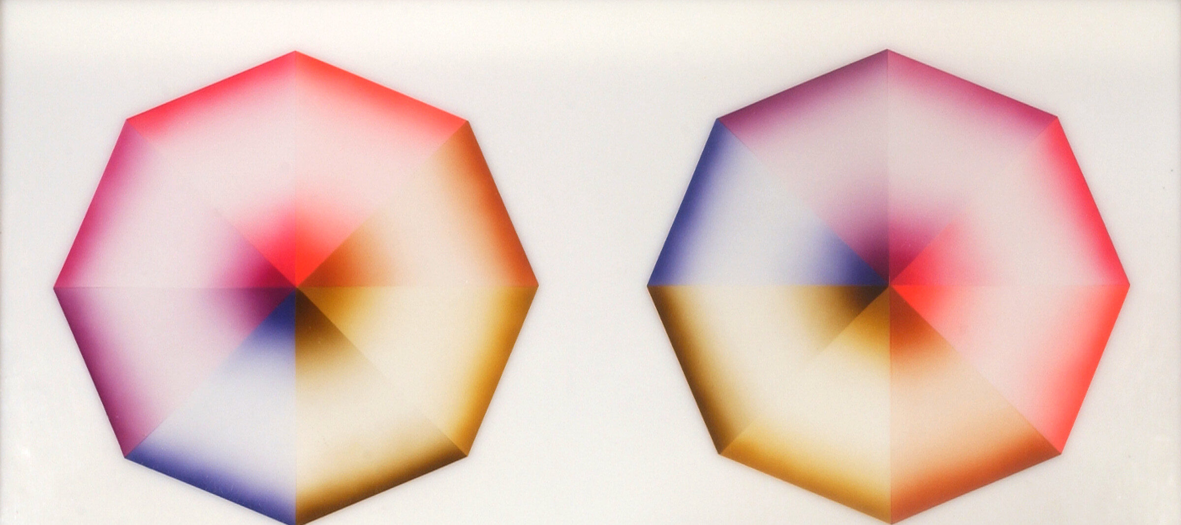Two hard-edged octagons, each divided into eight pie-slice shapes painted red, pink, orange, yellow, olive green, blue, violet, or lavender, occupy a square, white background. Dark at the wide and narrow ends of each wedge, the hues create the illusion of 3-dimensional forms.