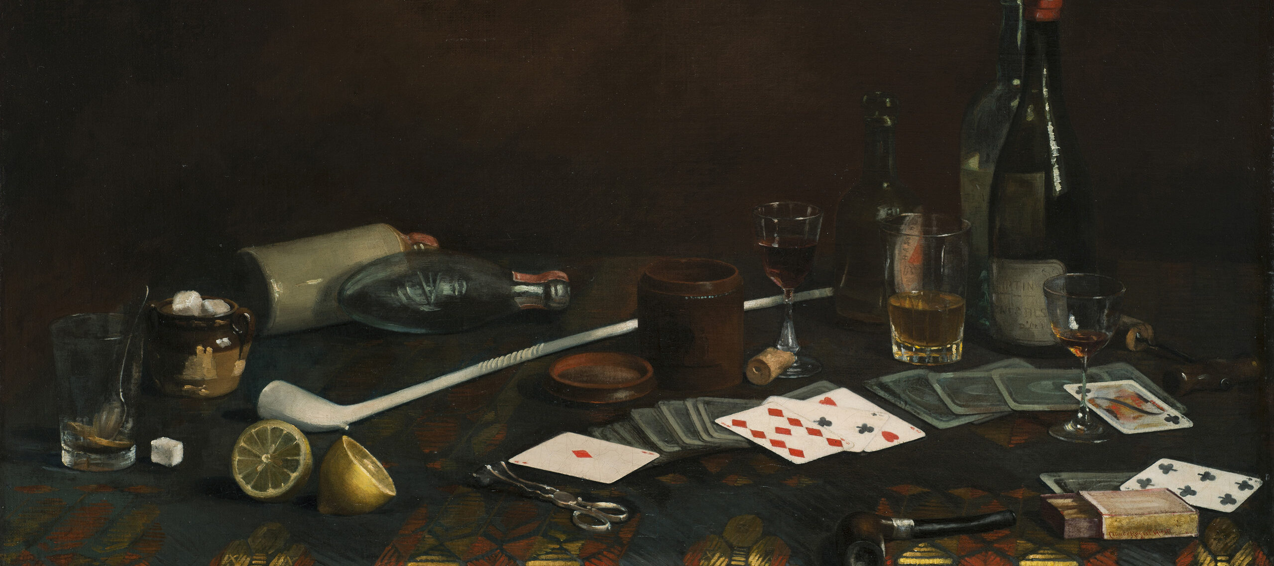 Painting of a blue tablecloth with gold and red pattern. Strewn across the top are half-empty glasses of wine and brown liquid, playing cards, lemon halves and matches. Two pipes, one long and white, one small and dark, lie next to a container of sugar cubes, corks, and bottles.