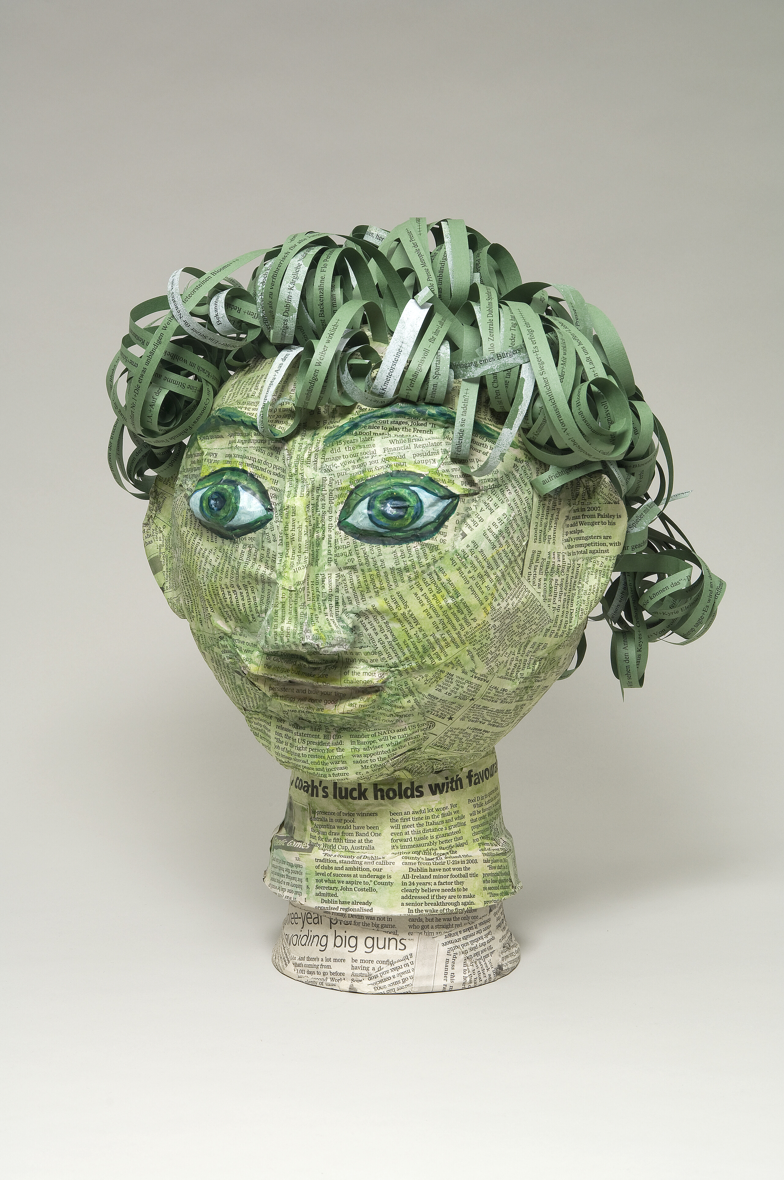 Papier-mâché head covered in clippings of pages from James Joyce's novel 