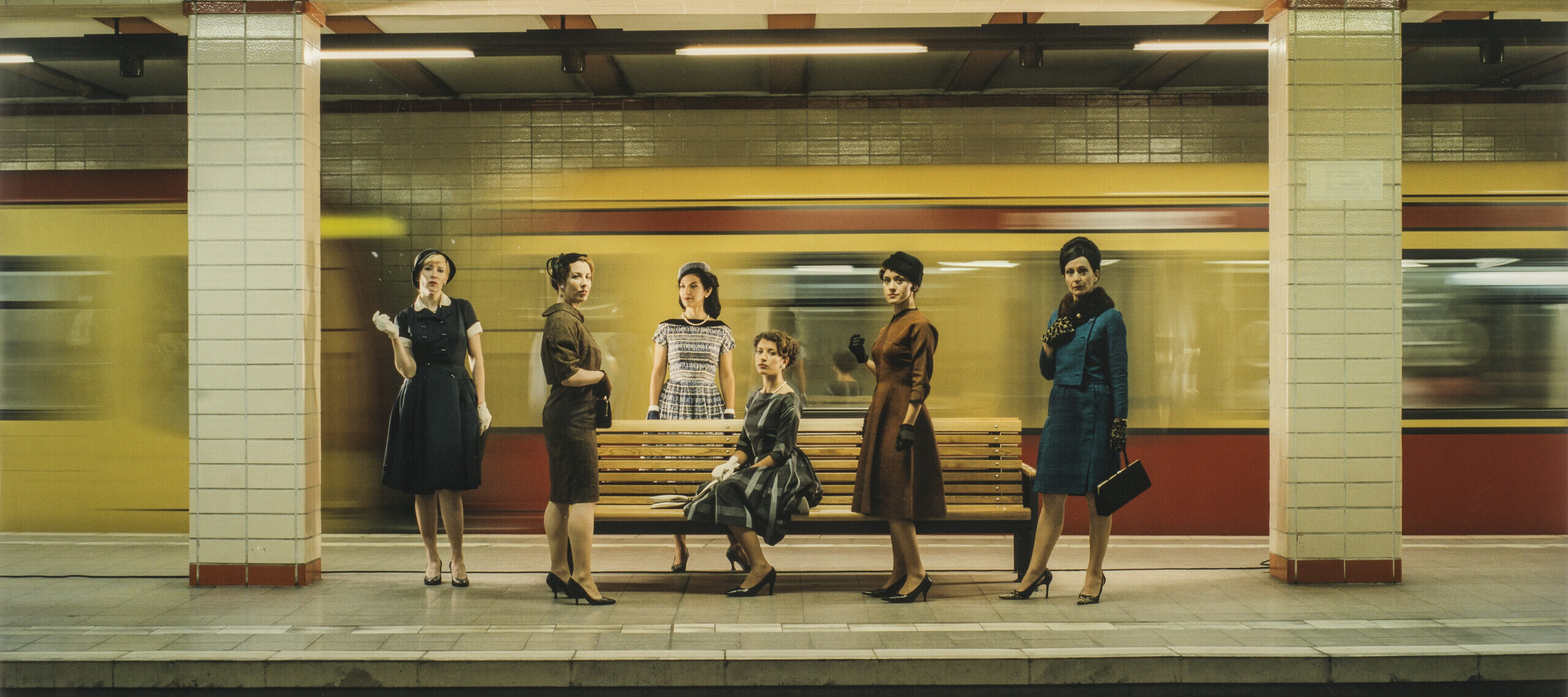 Eve Sussman, <i>Women in S-Bahn</i> (Photographic still from <i>The Rape of the Sabine Women</i>), 2005; Chromogenic color print, 39 3/8 x 51 1/4 in.; National Museum of Women in the Arts, Gift of Heather and Tony Podesta Collection; Photo by Lee Stalsworth