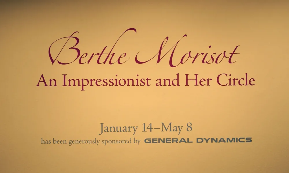 On a yellow wall, it says in big, red letters: "Berthe Morisot: An Impressionist and Her Circle".