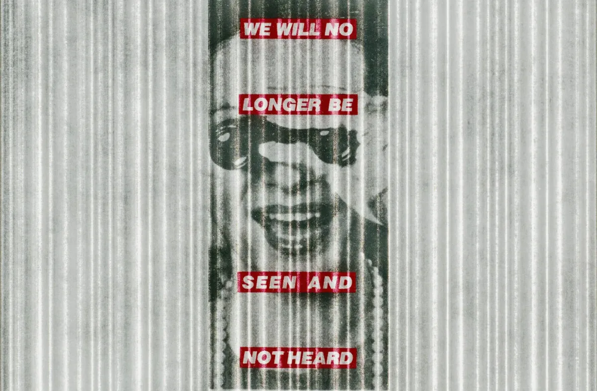 A black-and-white image of a light-skinned woman is centered atop a grey-and-white vertically striped background. She wears pearls and holds a pair of binoculars to her eyes while smiling widely. Superimposed over the image are four red horizontal bands with the phrase 'We will no longer be seen and not heard' in white block letters.