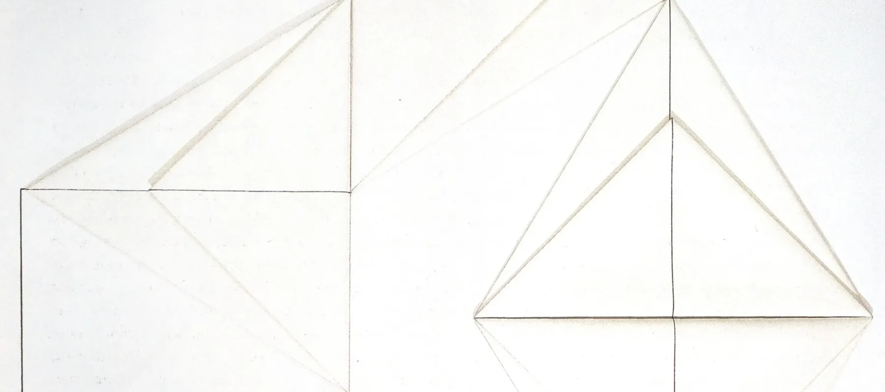 Six folded white triangles resembling origami form a large geometric shape on a white background. Connected by a continuous line that bisects their center, the corners of each triangle touch and encourage the eye to move in a circular fashion.