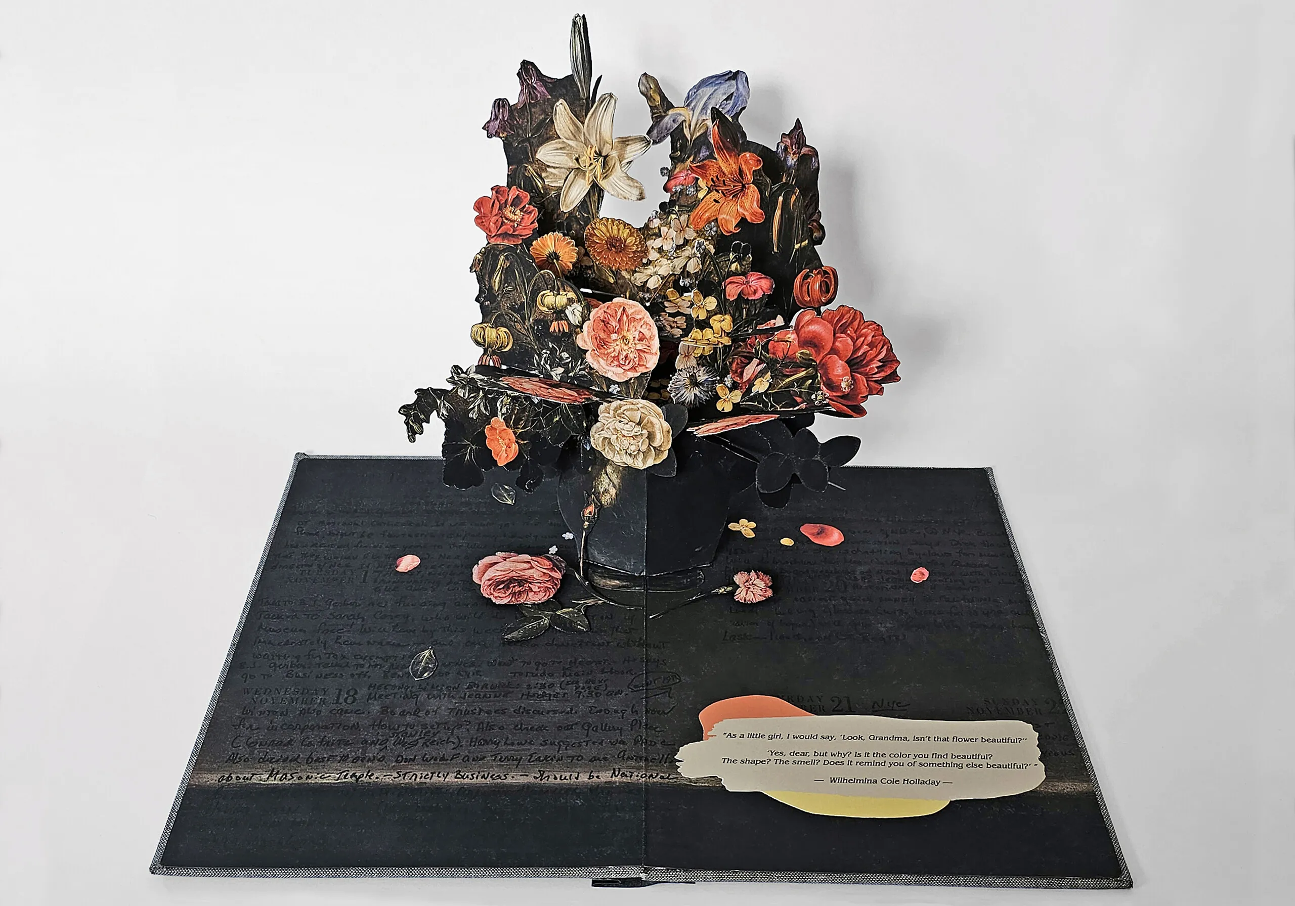 An artist's book, opened to reveal a pop-up of many colorful flowers in a vase. The pages are dark with black writing.