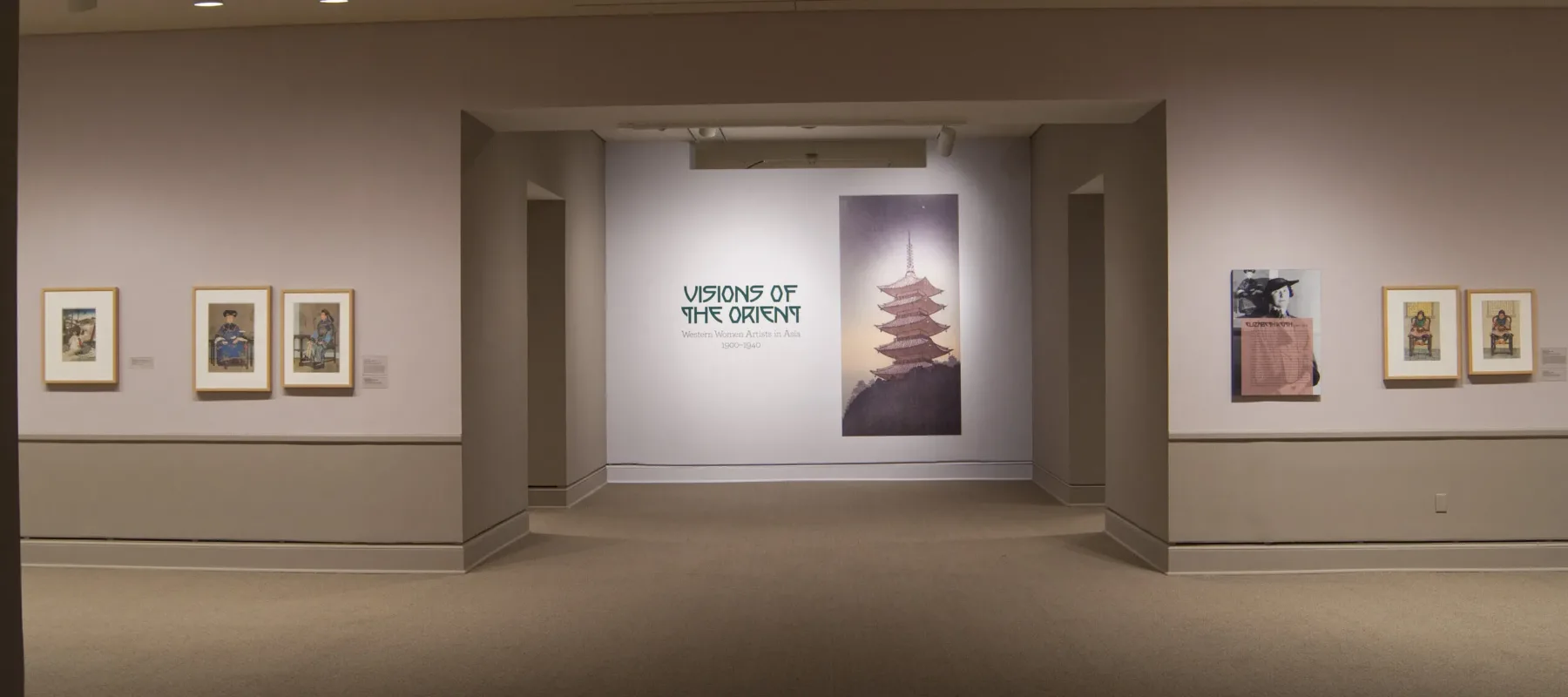 View of a gallery space. On a white wall, the text reads: "Visions of the Orient: Western Women Artists in Asia 1900–1940."