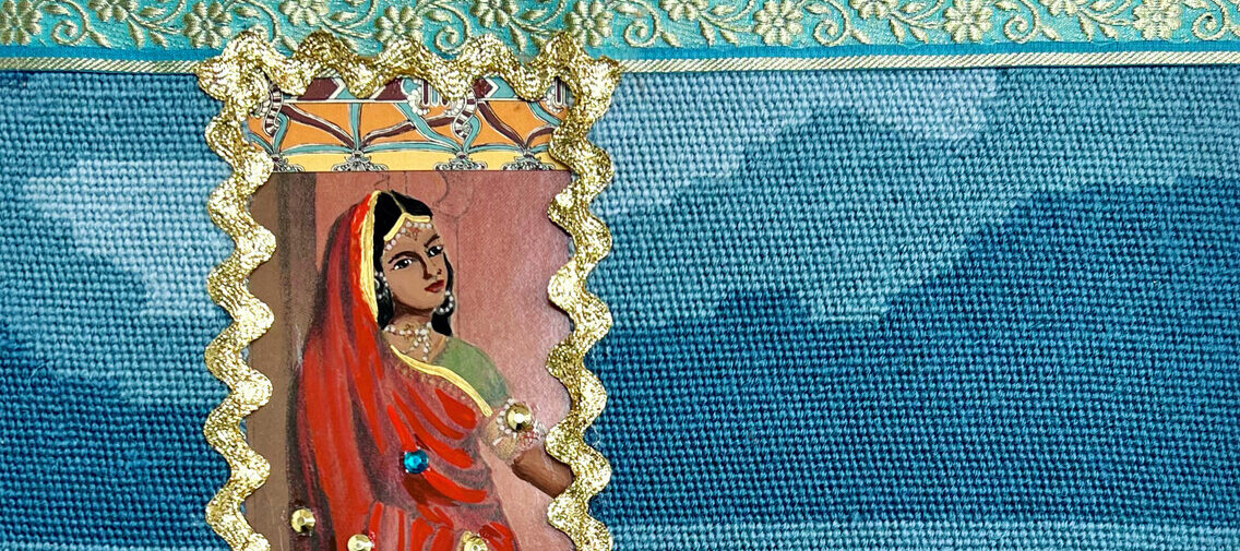 A mixed media work that uses a vintage needlepoint depicting the ocean and sky as its base. Layered over the needlepoint is an image of a standing dark-haired woman wearing a sari. Her lower half is covered in blue and gold rhinestones.