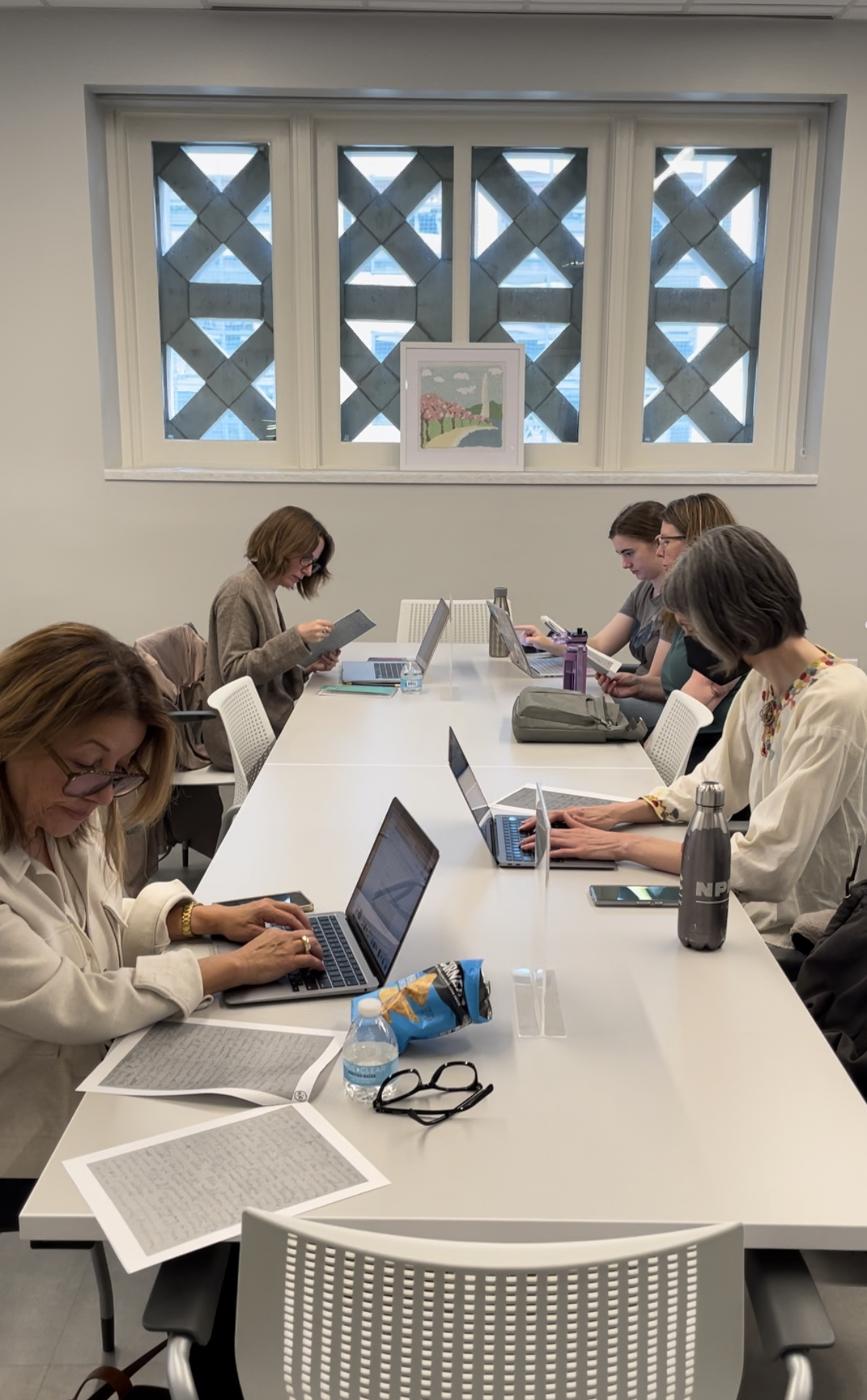 Participants use laptops to transcribe a photocopy of a letter.