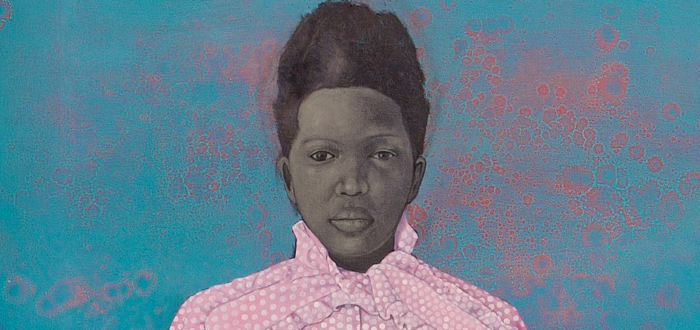 In this painted portrait, a woman with dark skin tone rendered in grayscale stands with her arms by her side, looking straight at the viewer. She is set against a blue background speckled with red, watery drips. She wears a short-sleeved polka-dot blouse with a bow at the collar and a white skirt.