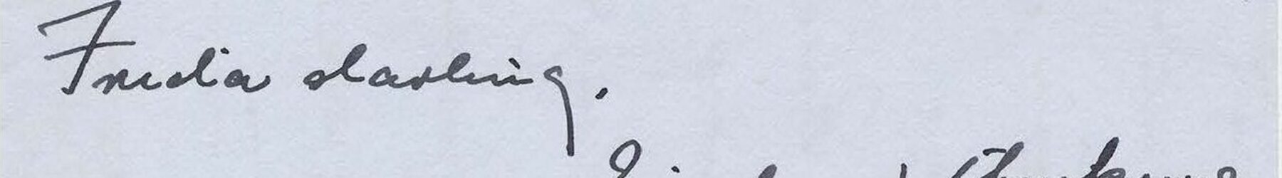 Handwritten letter on gray paper.