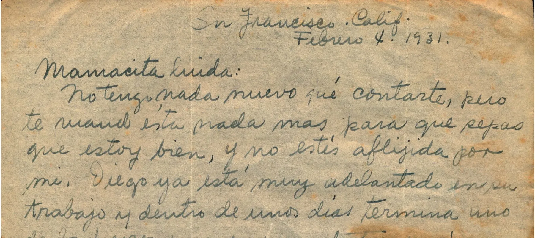 Handwritten letter on yellowed paper with red and brown staining.