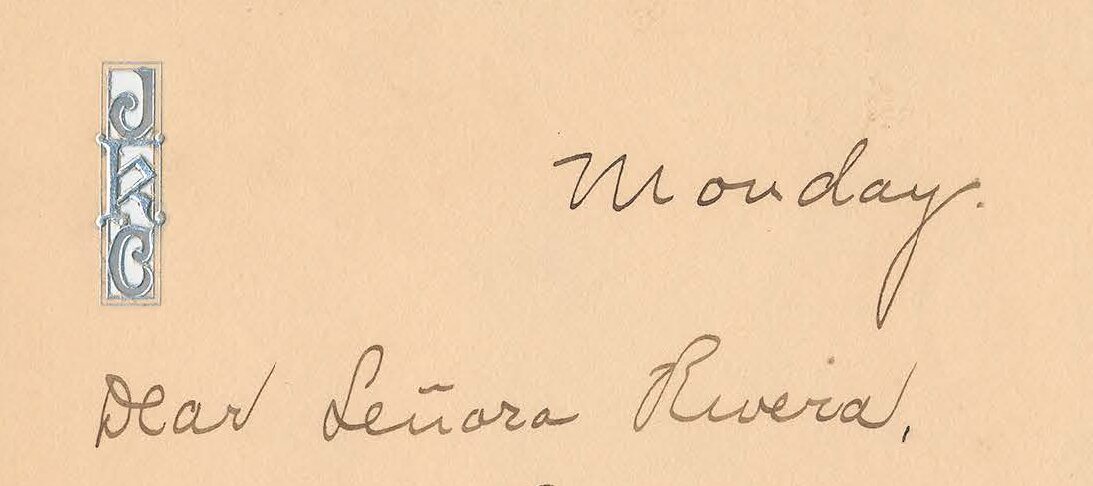 Handwritten note on aging personalized stationery with silver details.