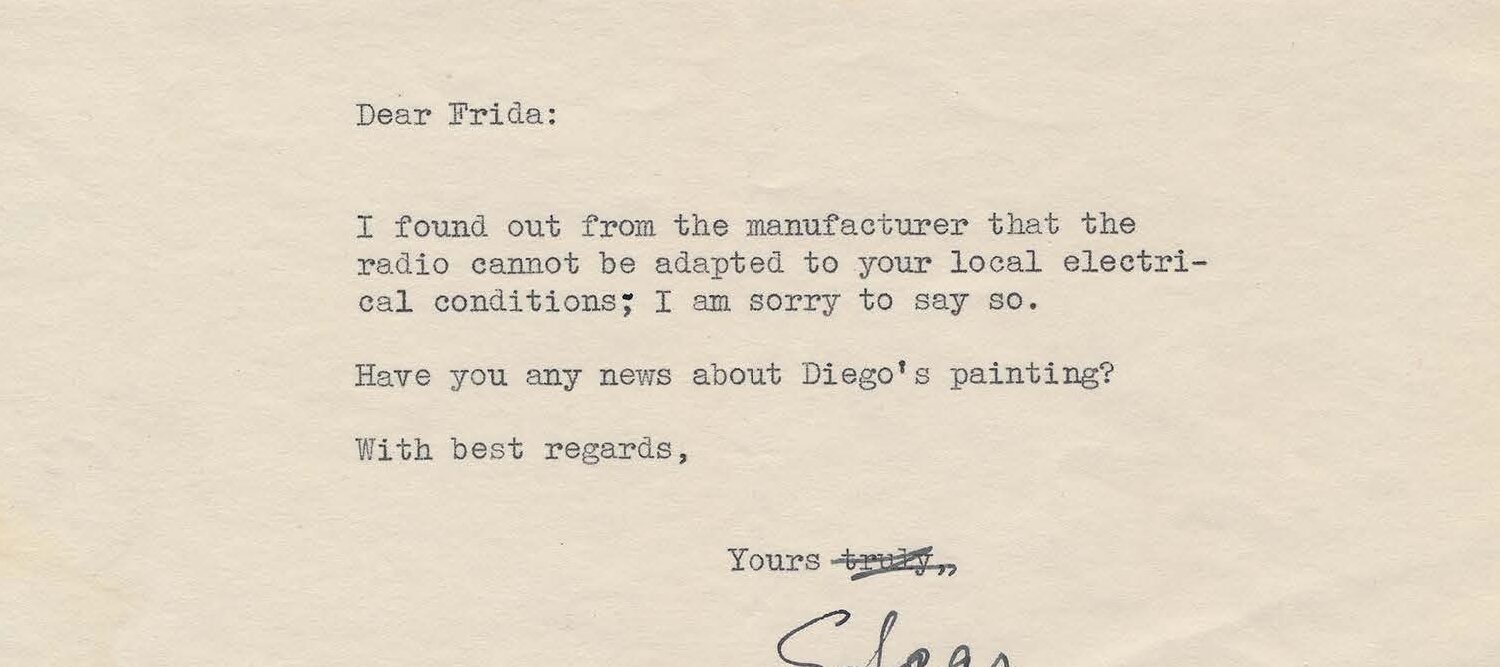 Typewritten letter on white paper with inked cross-out and signature.