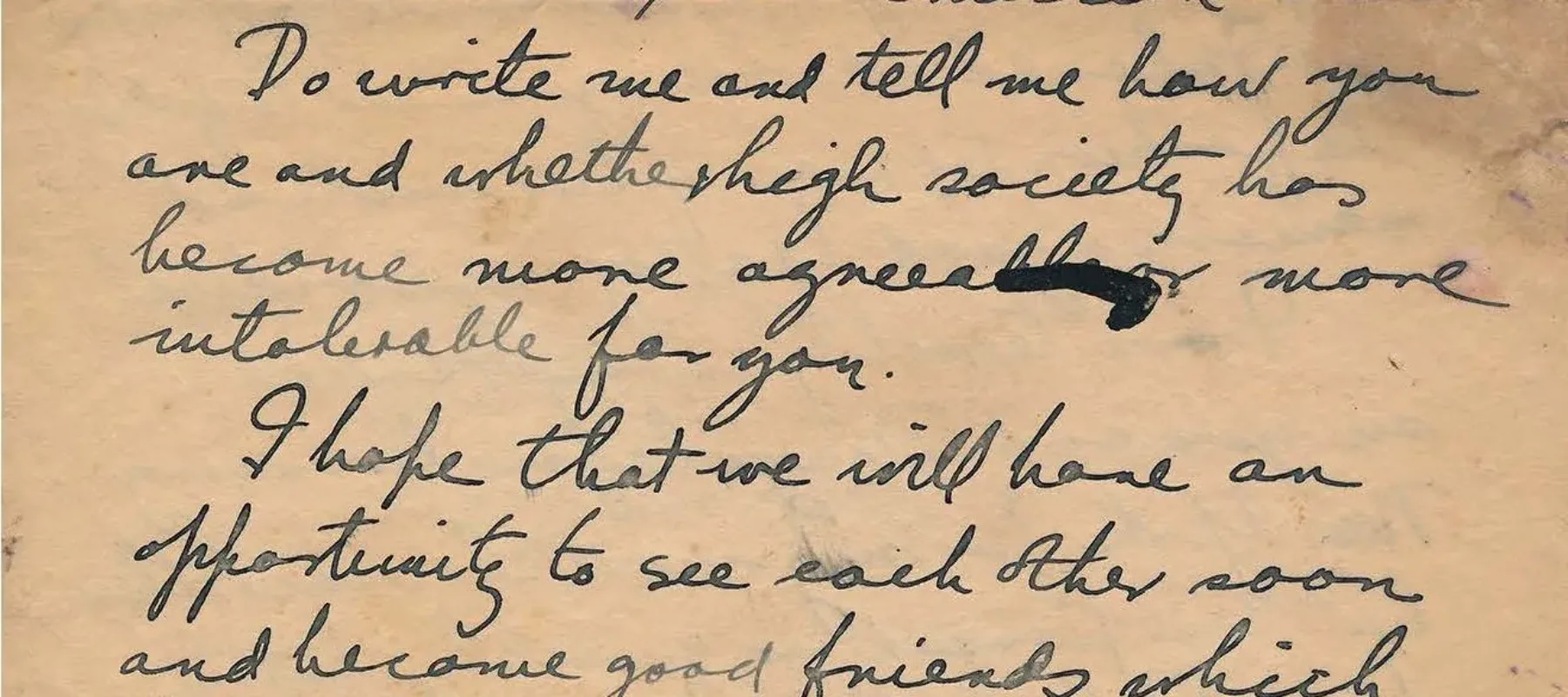 Handwritten letter with stains on brown paper.
