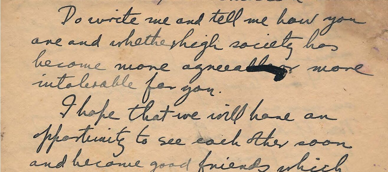 Handwritten letter with stains on brown paper.