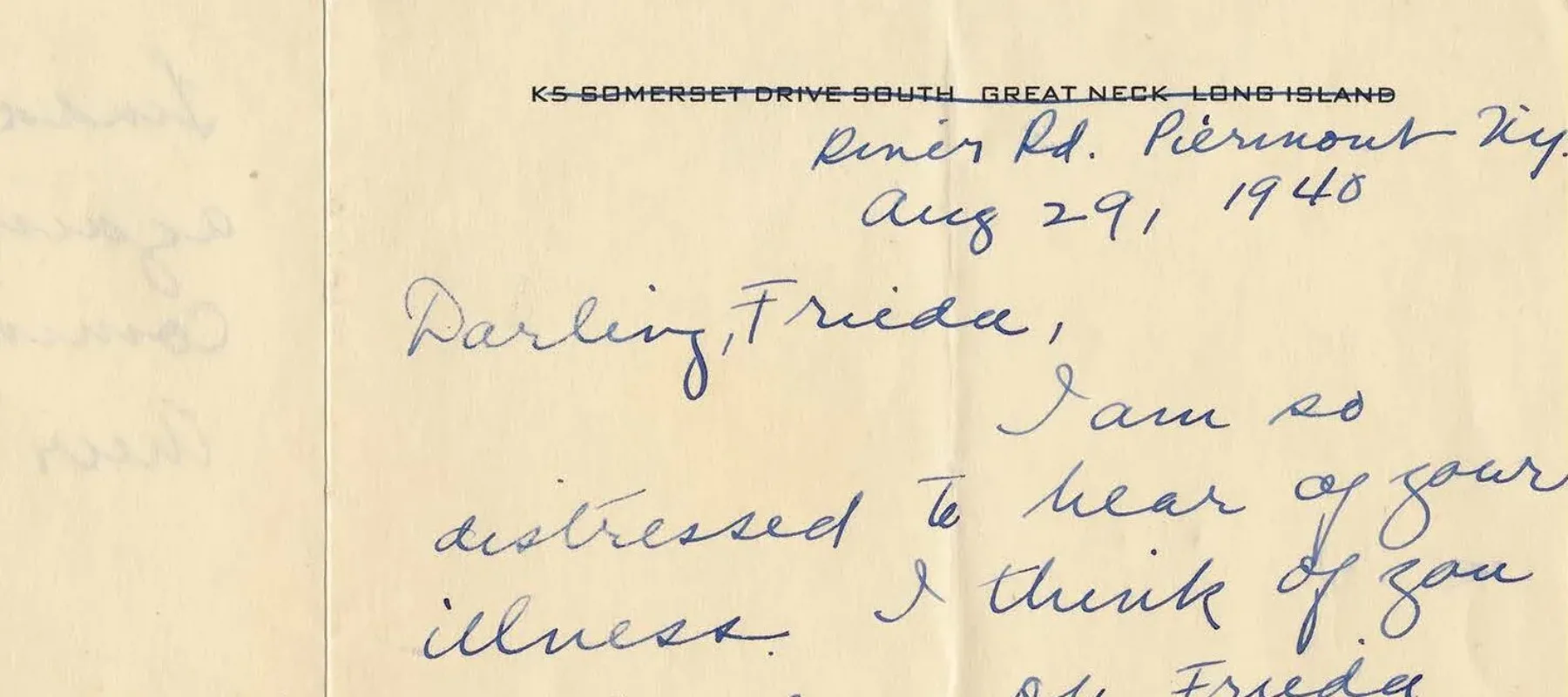 Handwritten letter on a yellowed folded notecard.