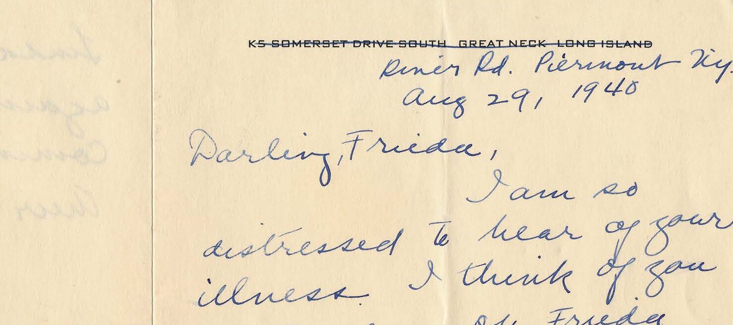 Handwritten letter on a yellowed folded notecard.