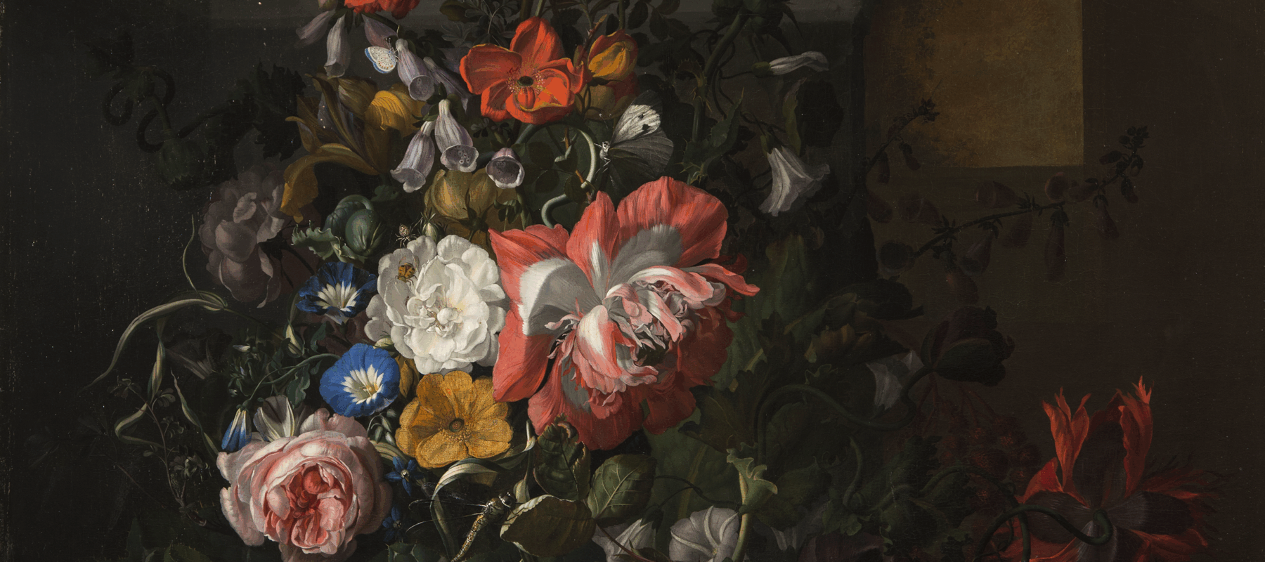 A still life painting featuring an asymmetrical arrangement of flowers; the central section features pink, orange, yellow, and blue flowers and is dramatically highlighted compared to the background and outer edge of arrangement.