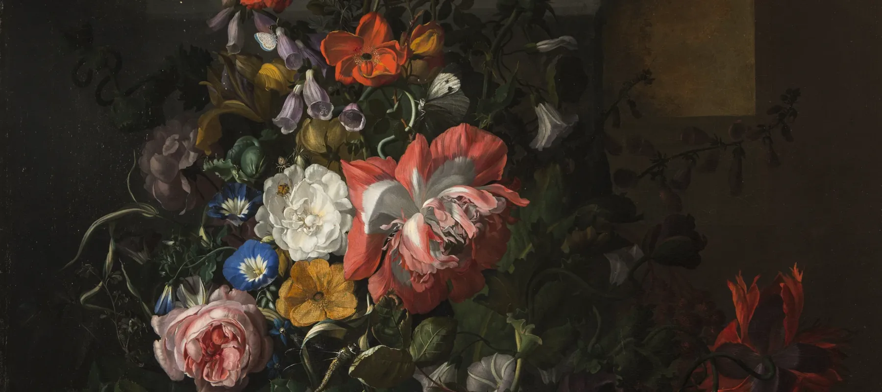 A still life painting featuring an asymmetrical arrangement of flowers; the central section features pink, orange, yellow, and blue flowers and is dramatically highlighted compared to the background and outer edge of arrangement.