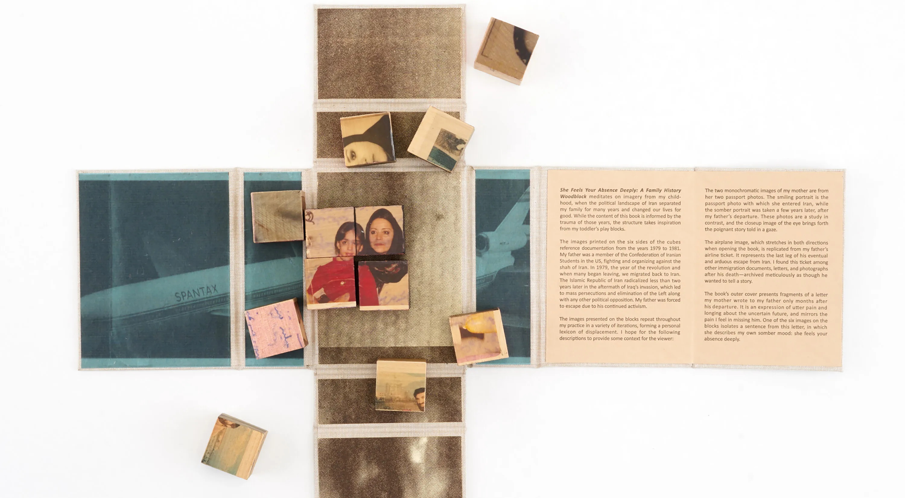 Wooden blocks with vintage photos and text are arranged on an unfolded book or map. Some blocks form a partially completed puzzle. The surrounding surface contains faded images and text panels.