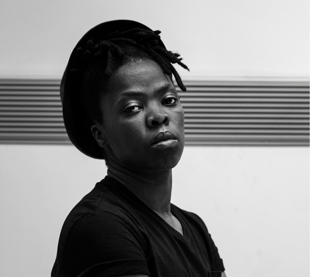 An individual is pictured in black and white.