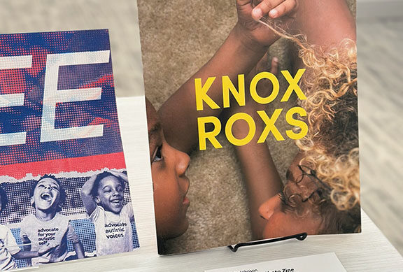 A colorful zine that reads "Knox Roxs" is on display with a museum label.