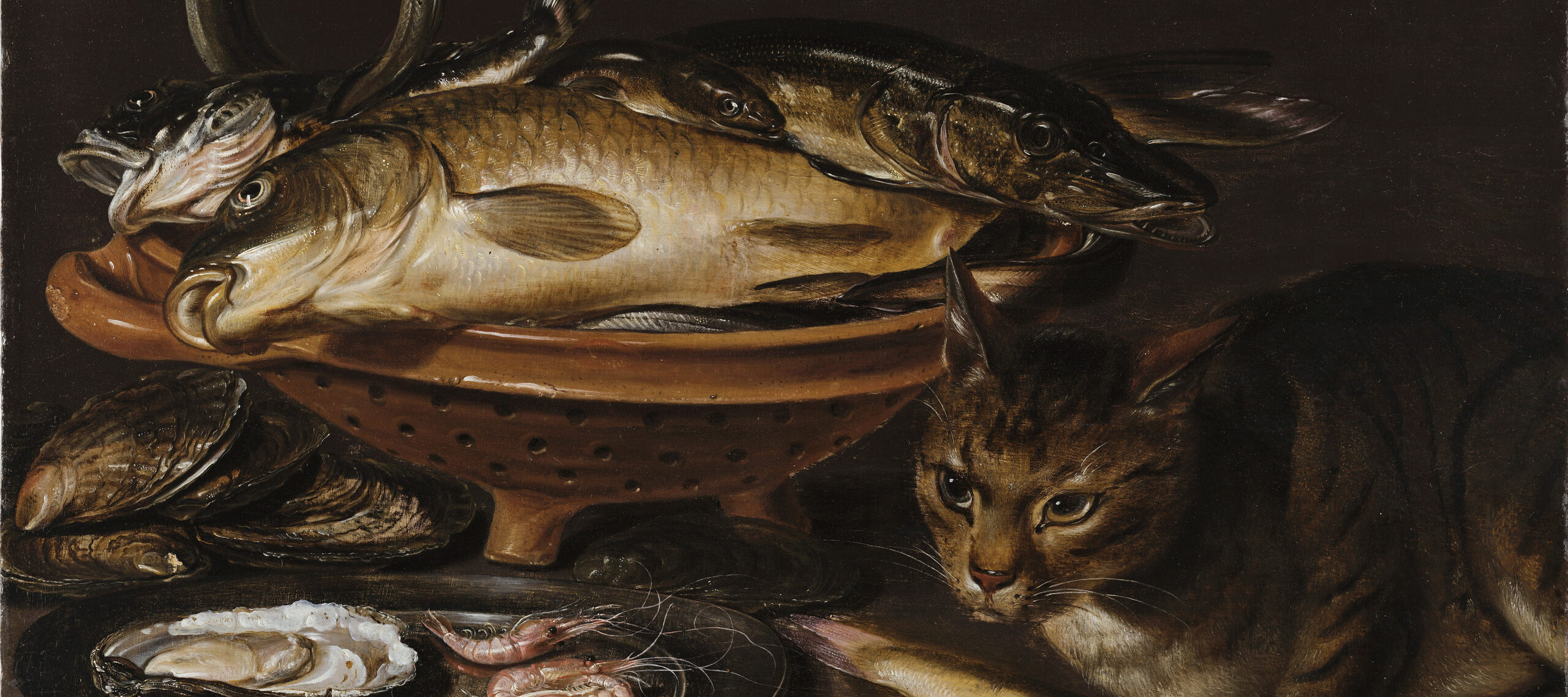 Still life painting features a reddish ceramic colander with several types of fish. In the foreground, a cat stands alert next to shrimp and oyster shells on a gleaming pewter dish.