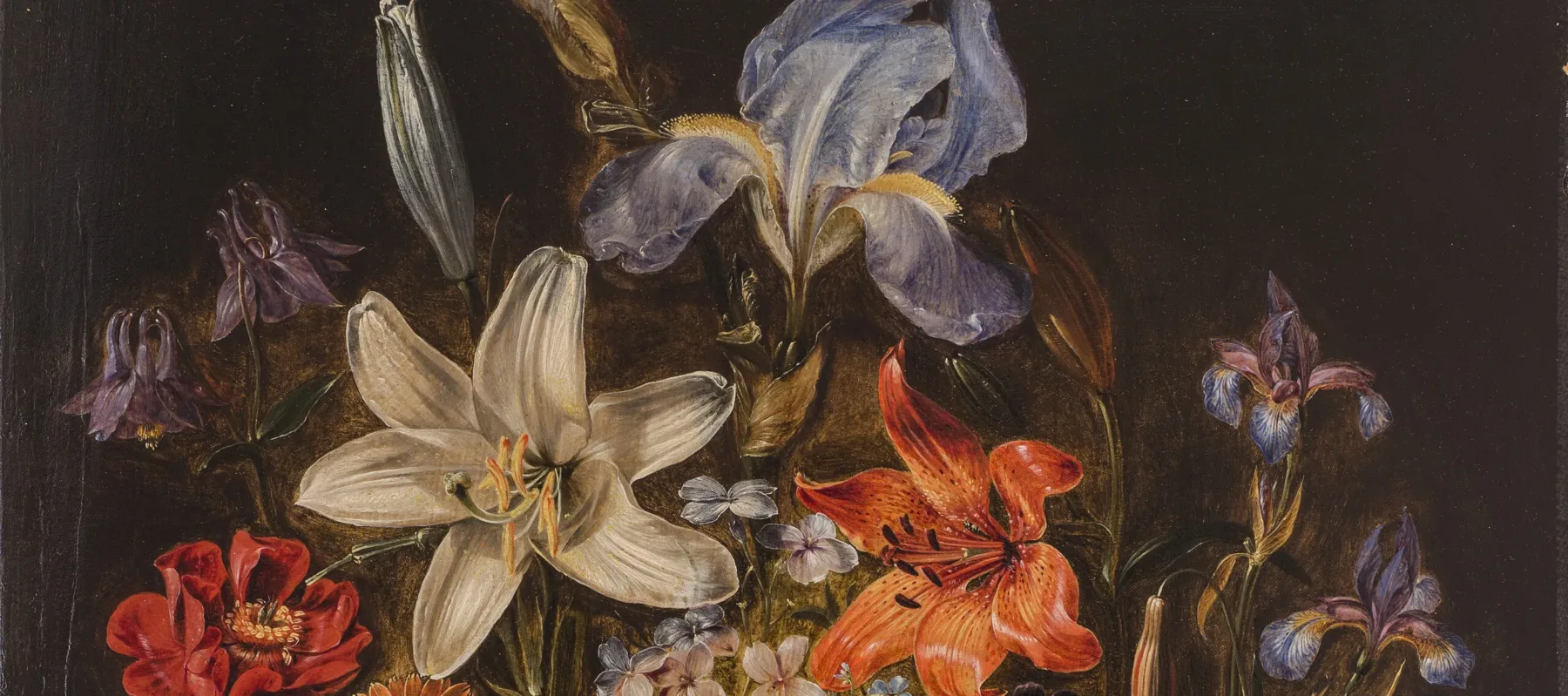 Realistic and detailed, the still life painting meticulously renders a variety of brightly colored flowers densely arranged in a dark round vase set against a dark background. The vase sits upon a stone ledge with two stray pink roses laying in the foreground.