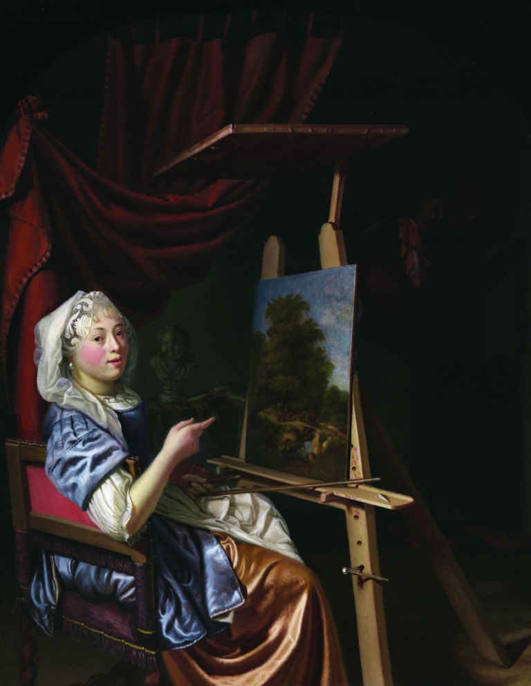 A woman in historical clothing sits at an easel, painting a landscape. She looks at the viewer, pointing at her artwork. The scene is set indoors with dark drapery and a shelf in the background.