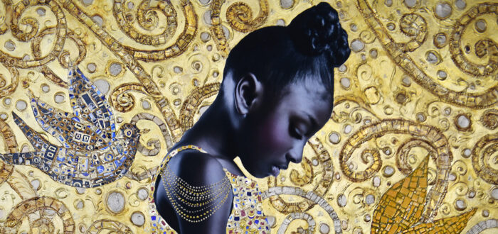 A photograph of a young Black girl in profile, looking down at her hands. Her dress and the image's background are covered in gold leaf. The background features a motif of birds and spirals.