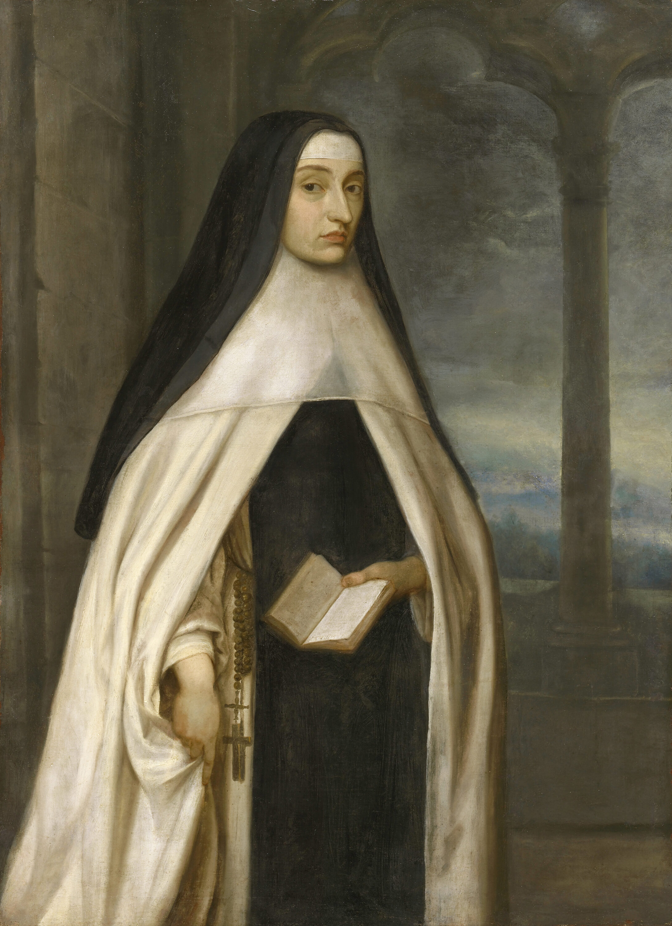 A woman wearing a black veil and white religious habit stands indoors, holding a book. The background shows stone columns and an arched window revealing a cloudy sky and distant landscape.