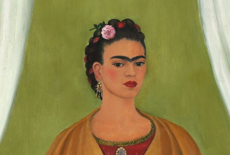 In a painted self-portrait, the artist stands in a stage-like space framed by white curtains. Beneath black hair woven with red yarn and flowers, heavy brows accent her dark-eyed gaze. Clad in a fringed, honey-toned shawl; long, pink skirt; and gold jewelry, she holds a bouquet and a handwritten letter.