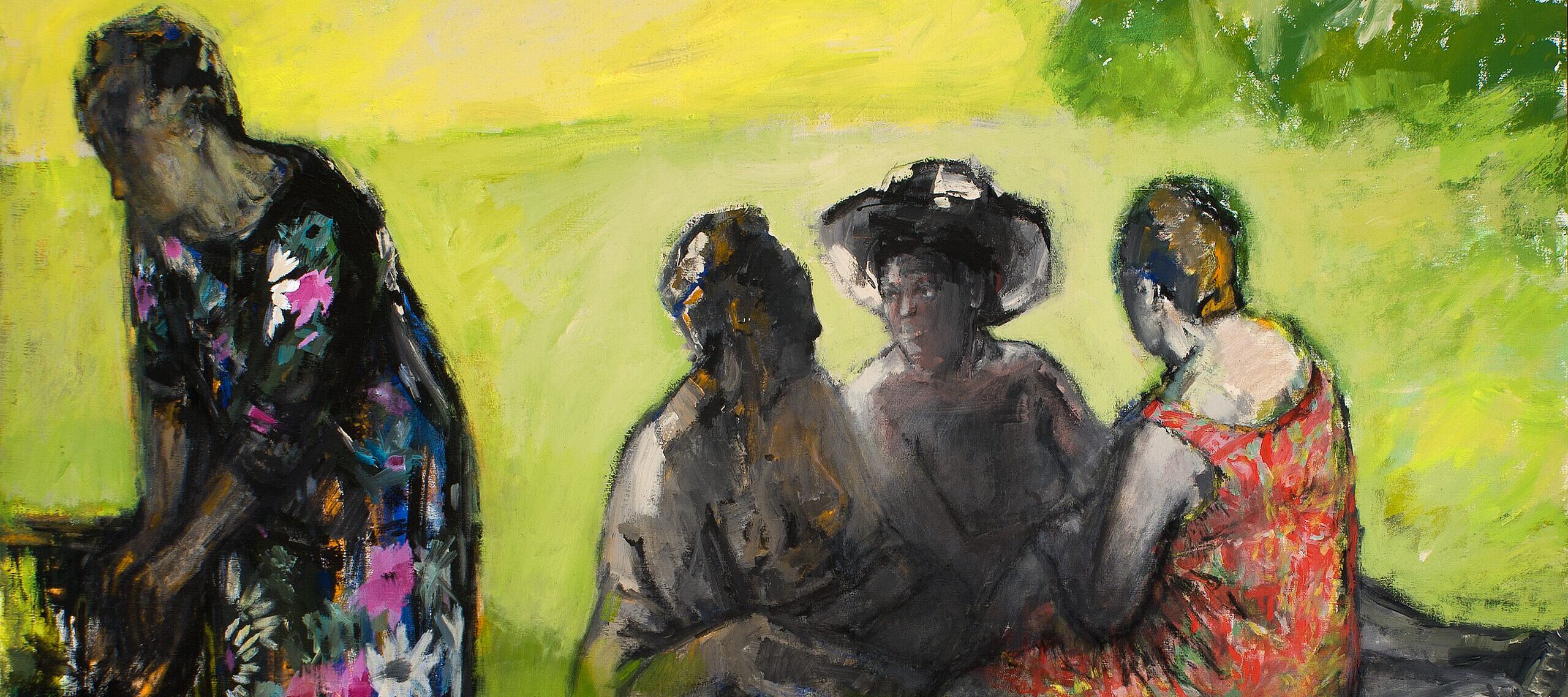 Four people are depicted outdoors on green grass; three are seated and talking, two in hats, while one person in a floral dress stands to the left, partially turned away. The scene is painted in vibrant, impressionistic colors.