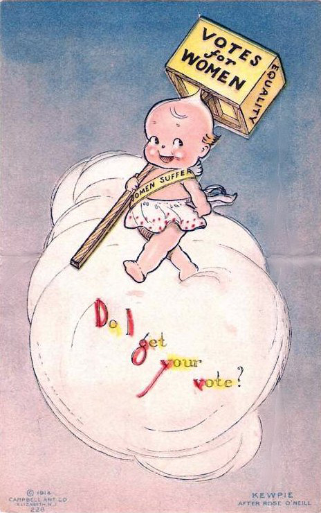 A cartoon baby in a dress floats on a cloud, holding a large sign that reads “Votes for Women.” The stick has “Women Suffrage” on it. Colorful text below says, “Did I get your vote?”.