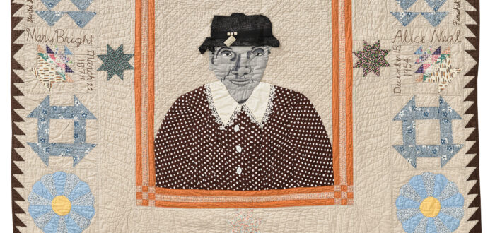 A central embroidered and collaged fabric portrait shows a gray-complexioned woman in a brown-and-white polka dot dress and black hat. The portrait is surrounded by various traditional quilt blocks on a beige surface.